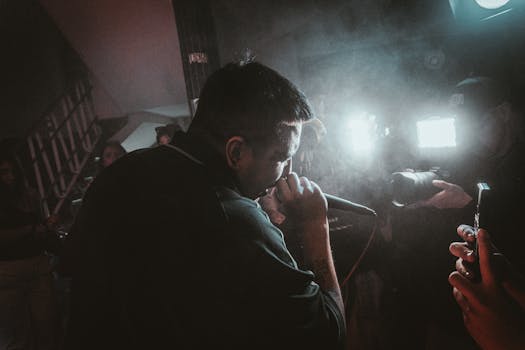 Dynamic live music performance scene featuring a singer onstage during a concert.