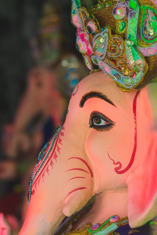 Free A detailed close-up of a vibrant Ganesha statue in a Kolkata workshop, showcasing intricate craftsmanship. Stock Photo