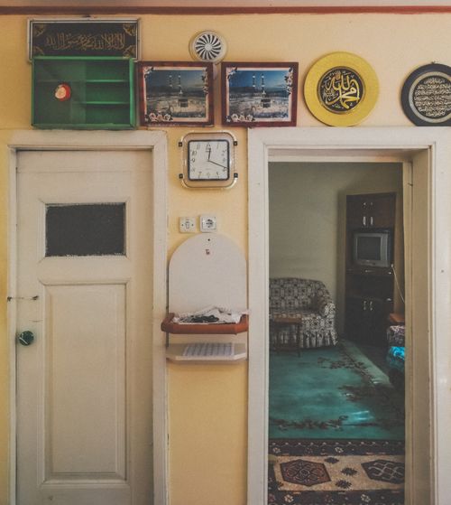 Free A warm view of a vintage hallway and living room, showcasing traditional decorations and cozy ambiance. Stock Photo