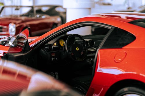 Free Explore the elegant interior of a red sports car with classic design. Perfect for automotive enthusiasts. Stock Photo