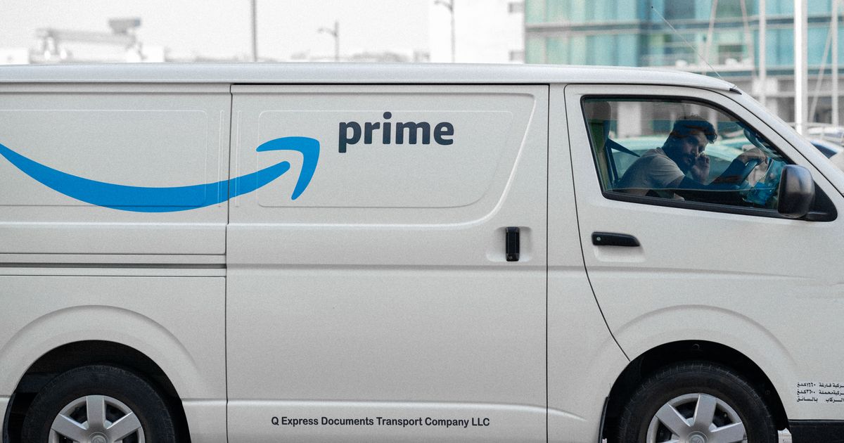 A delivery van parked in a city street, representing a change in the state of delivery (CISD) in trading