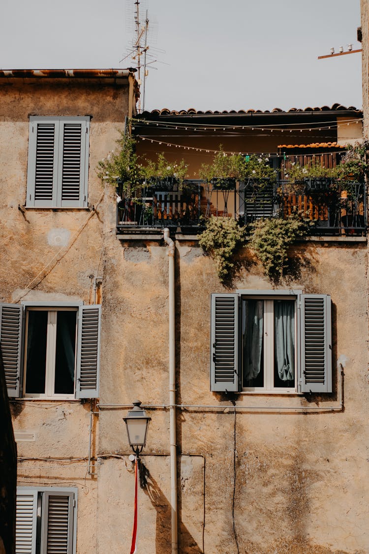 Balcony And Windows In House Building