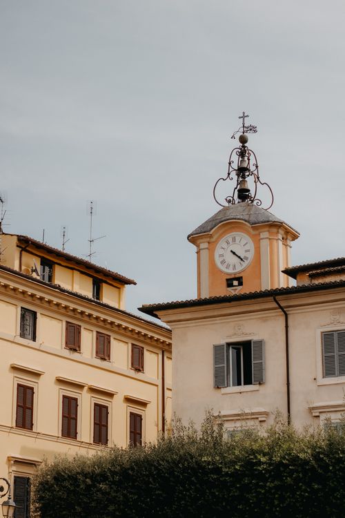 Free Elegant architecture featuring a historic clock tower against a cloudy sky. Stock Photo
