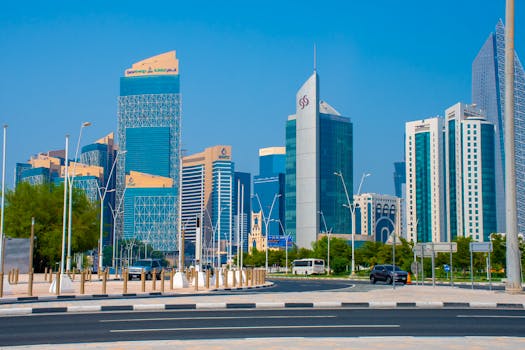 Capture of Doha's towering skyline featuring modern architecture and clear blue skies.