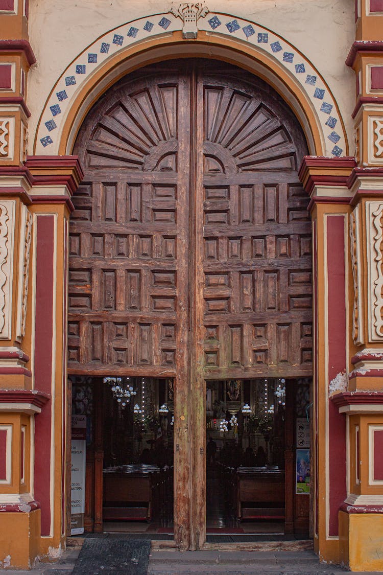 Ornate Arched Wooden Doors Of A Church