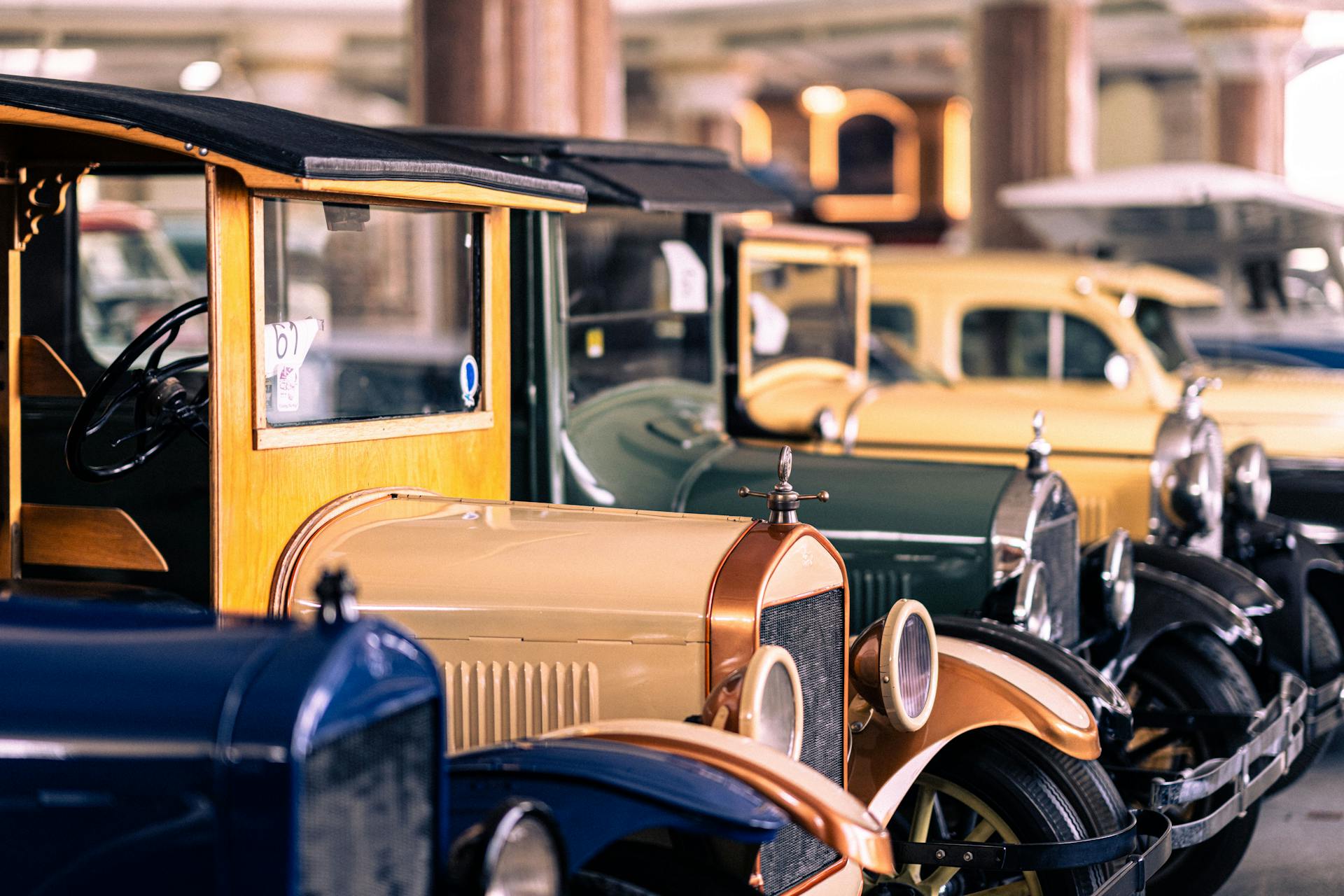 A Row of Antique Cars Exhibited in a Museum