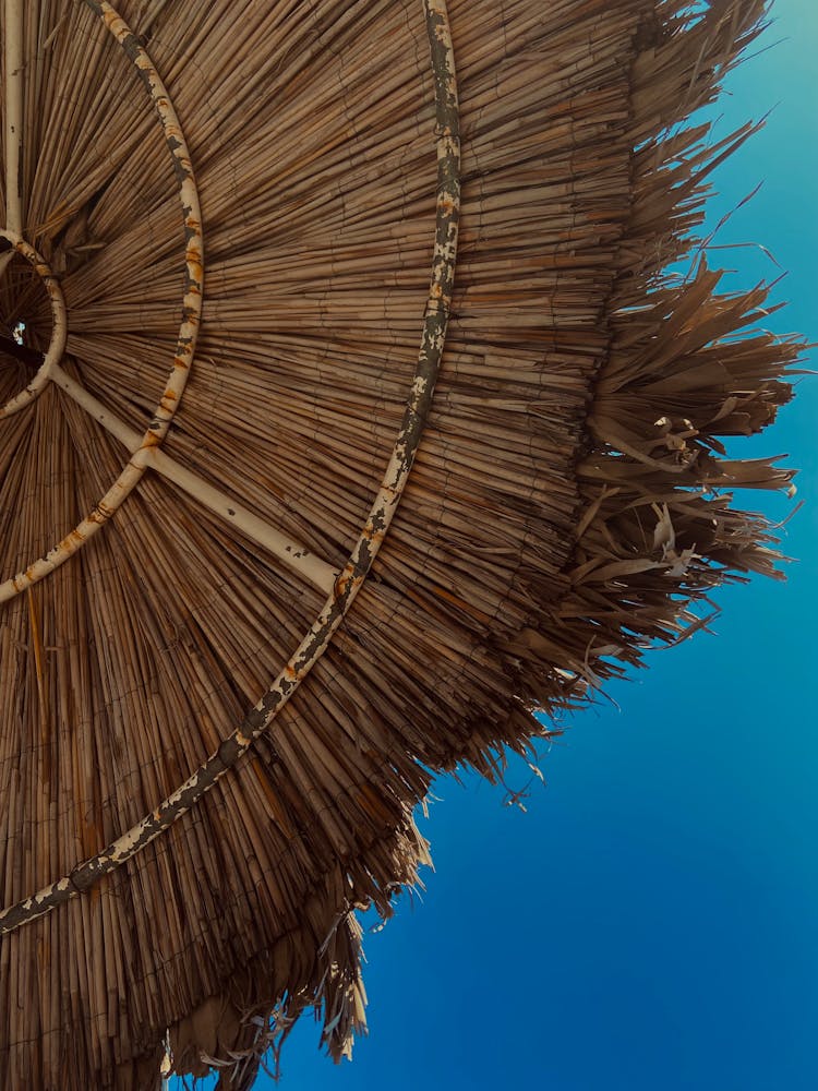 Straw Umbrella On A Beach