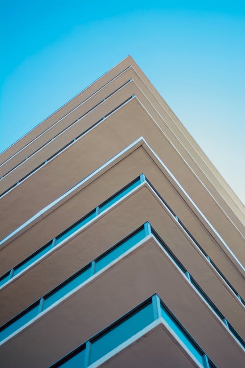 Free Low-angle Photography of Concrete Building Stock Photo