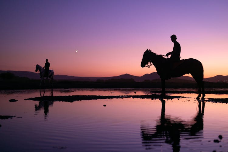 Men On Horses In The Evening