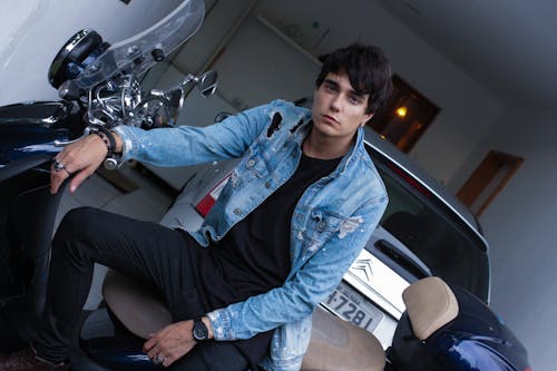 Photo of Man Sitting On Motorcycle