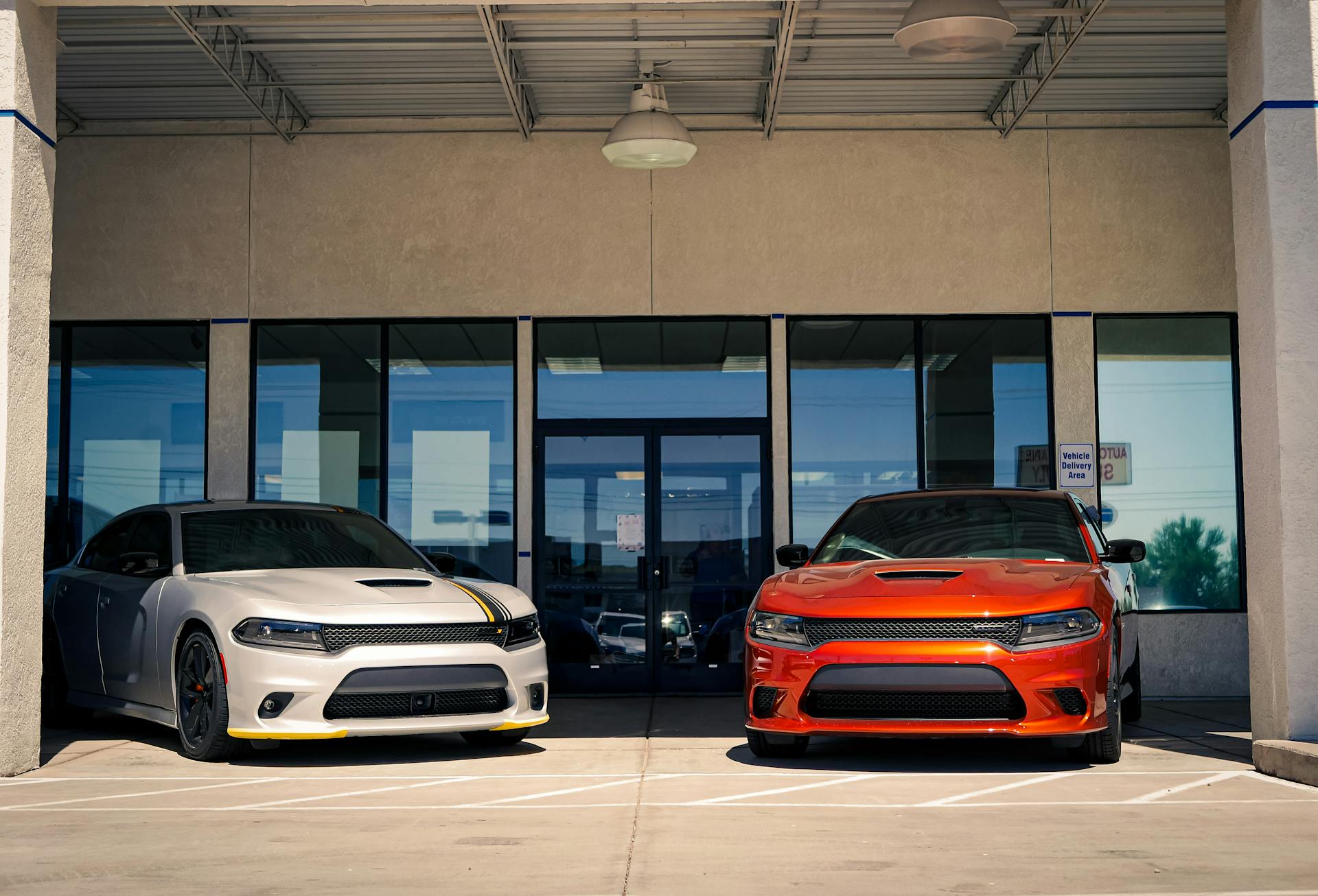 Dodge Challengers in Front of the Entrance to the Car Dealership