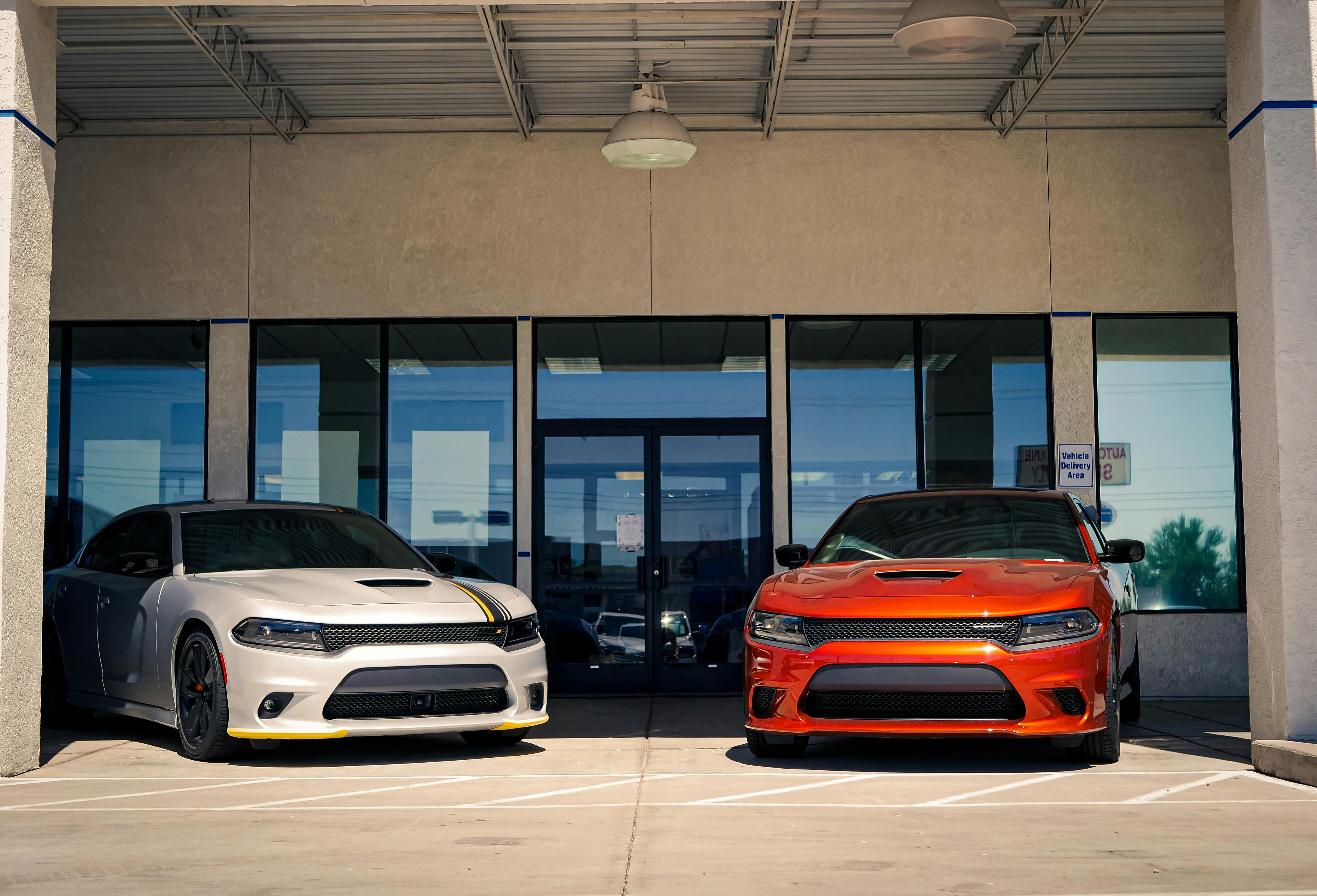 Dodge Challengers in Front of the Entrance to the Car Dealership