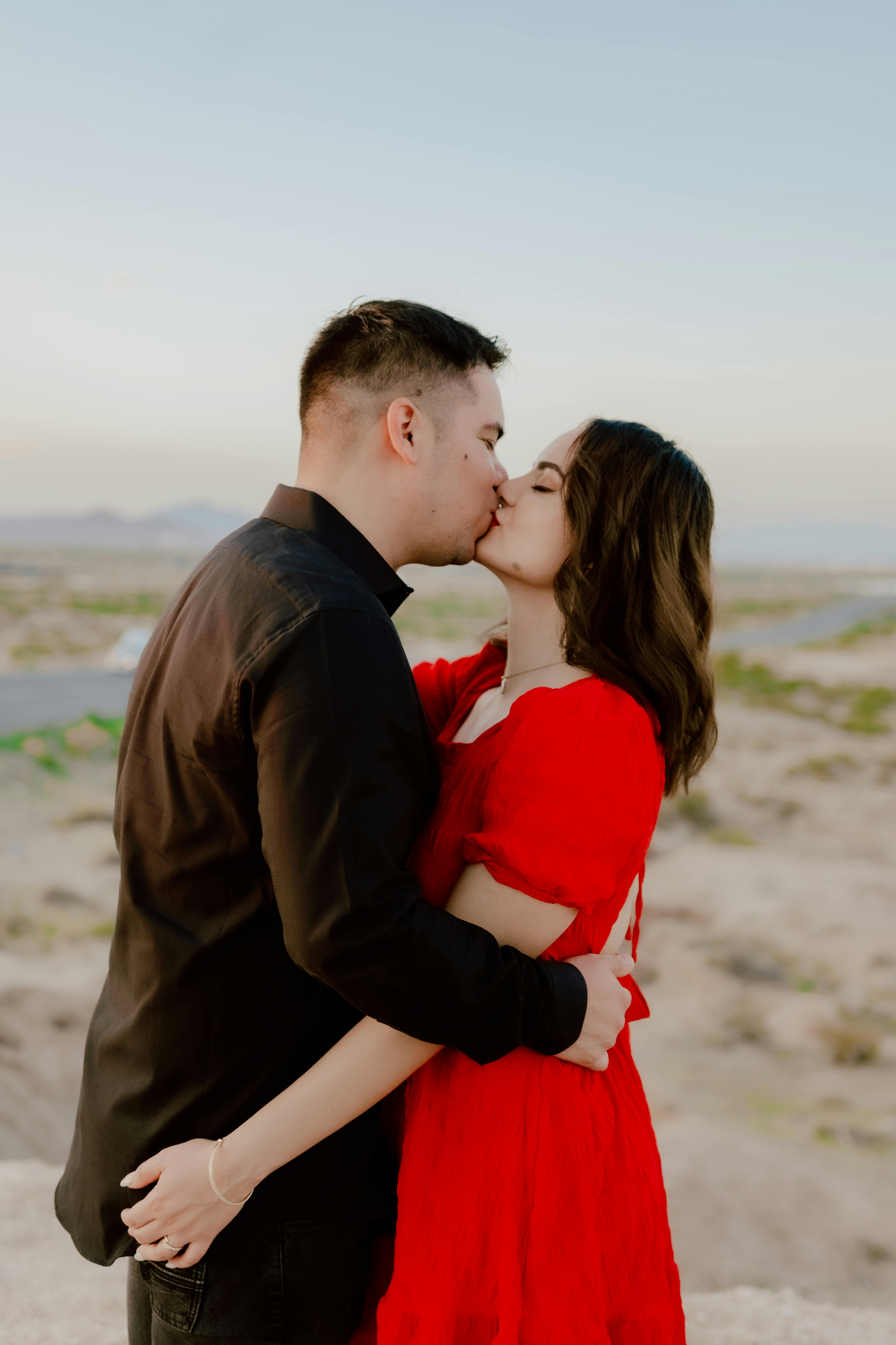 Couple Embracing and Kissing · Free Stock Photo