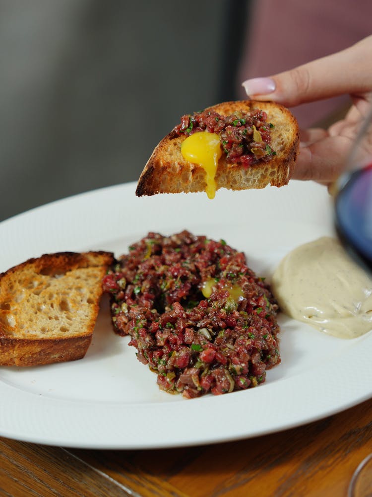 Woman Eating Steak Tartare