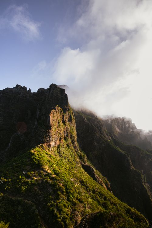 Free Stunning view of Madeira's rocky mountain peaks under clear skies and sunlight. Stock Photo