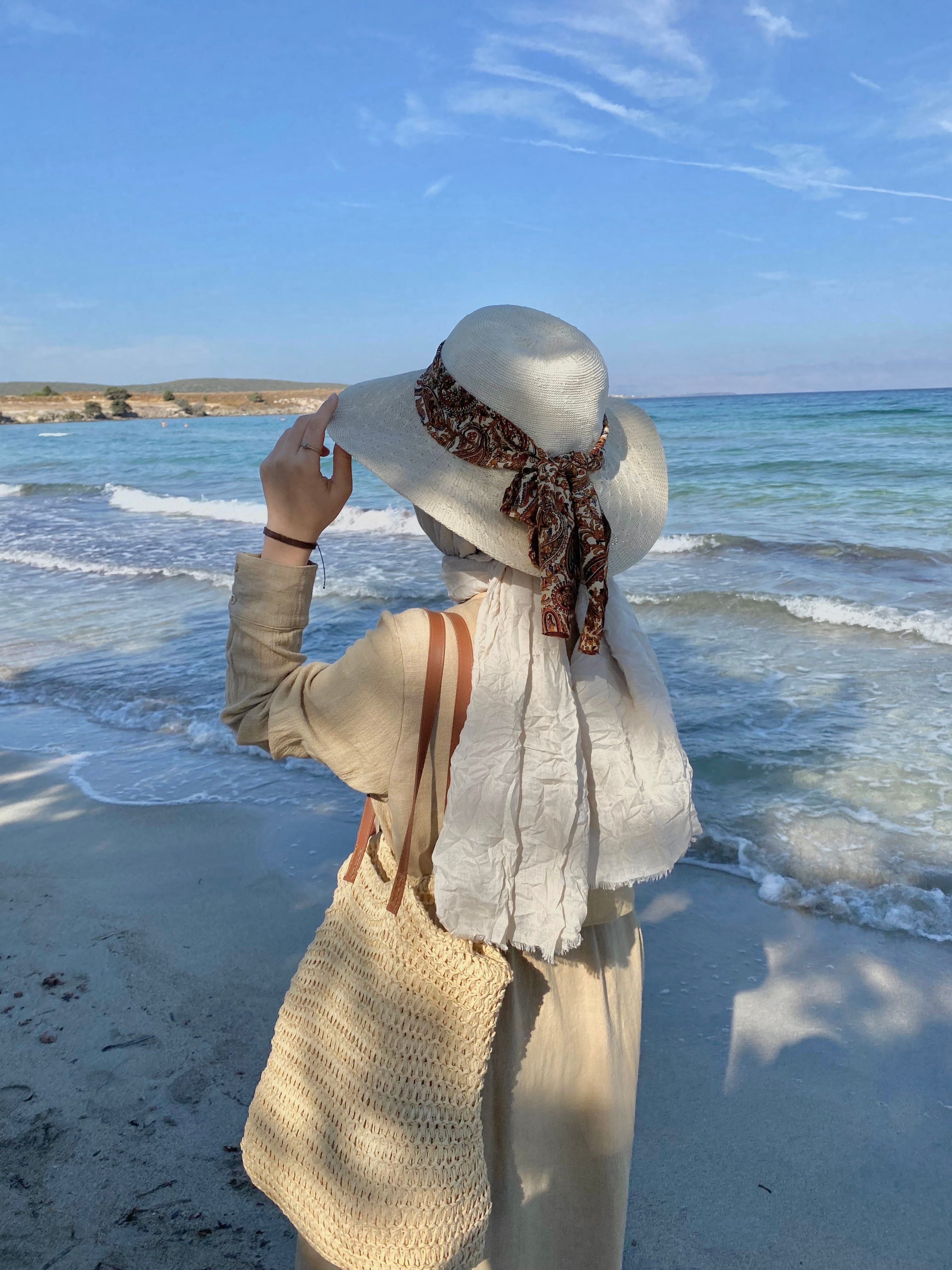 Woman in Hat Standing on Beach · Free Stock Photo