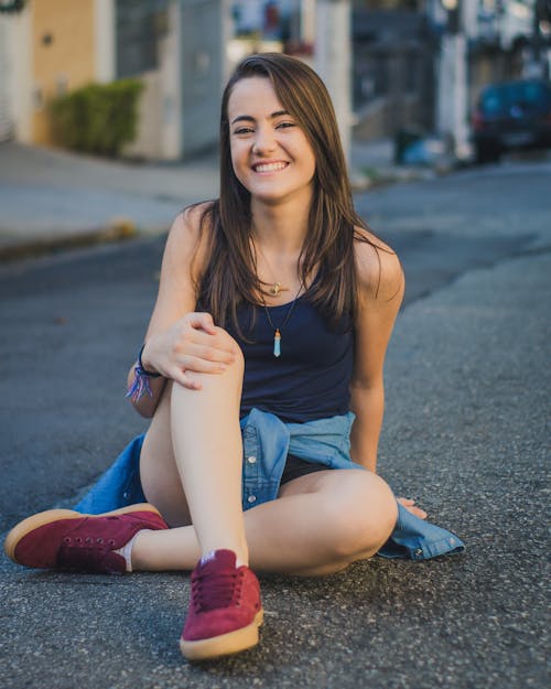 Woman Sitting on Road