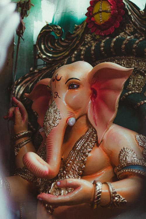 Painted Figurine of Ganesha on a Throne