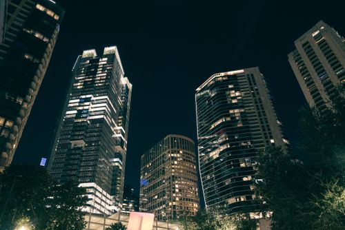 Free Stunning urban nightscape with illuminated skyscrapers and modern architecture. Stock Photo