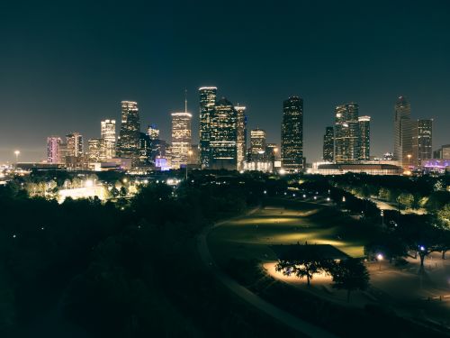 Free Stunning aerial view of Houston skyscrapers illuminated at night with vibrant city lights. Stock Photo