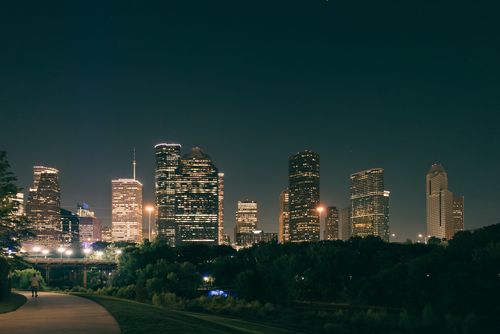 Free Stunning view of Houston's illuminated skyline during a serene night from a nearby park. Stock Photo