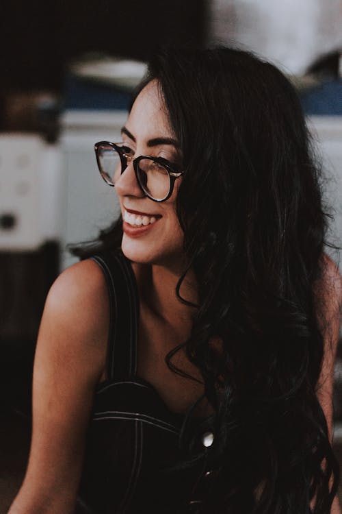 Photo of Woman Wearing Eyeglasses