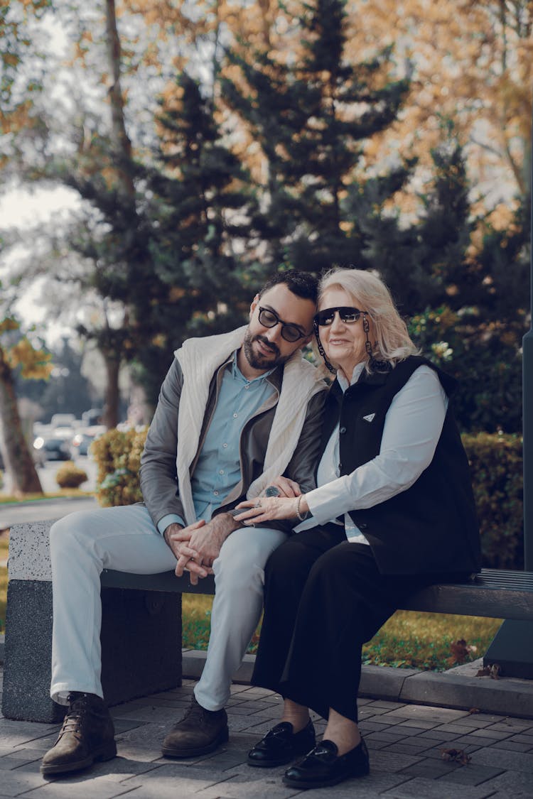 Mature Couple Sitting On Bench