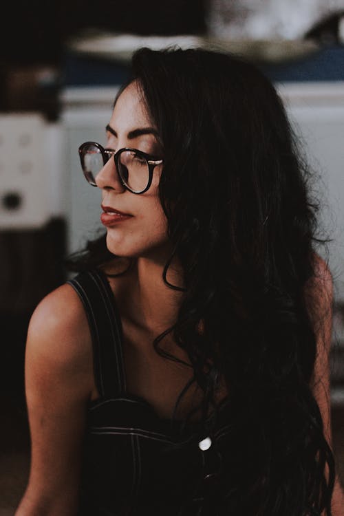 Woman Wearing Eyeglasses Looking Towards Right