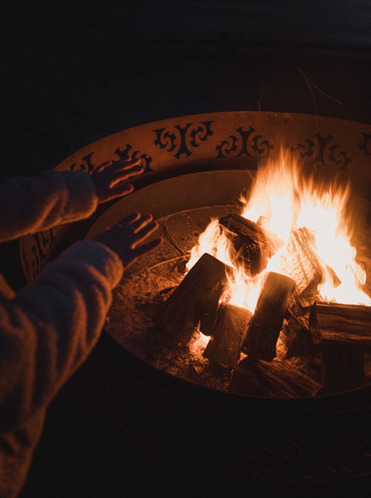 Warming Hands Over Bonfire