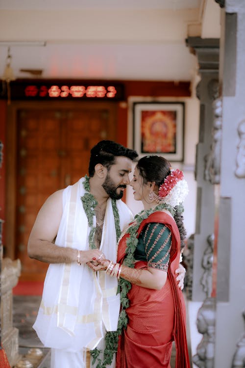 Smiling Couple in Traditional Costumes Dancing