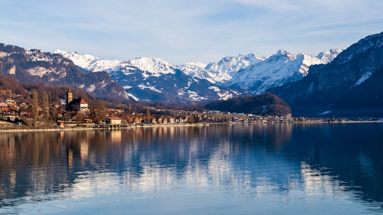 Panorama Of Brienz Lake With A Village Under Mountains