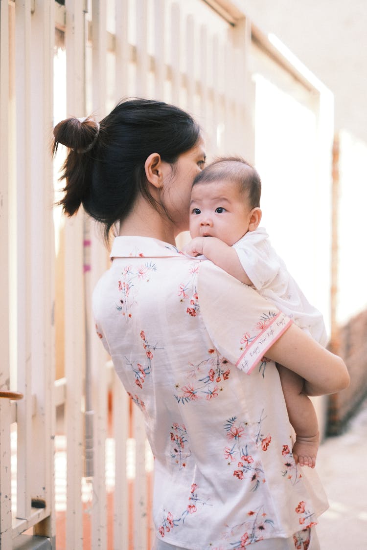 A Mother Holding Her Child