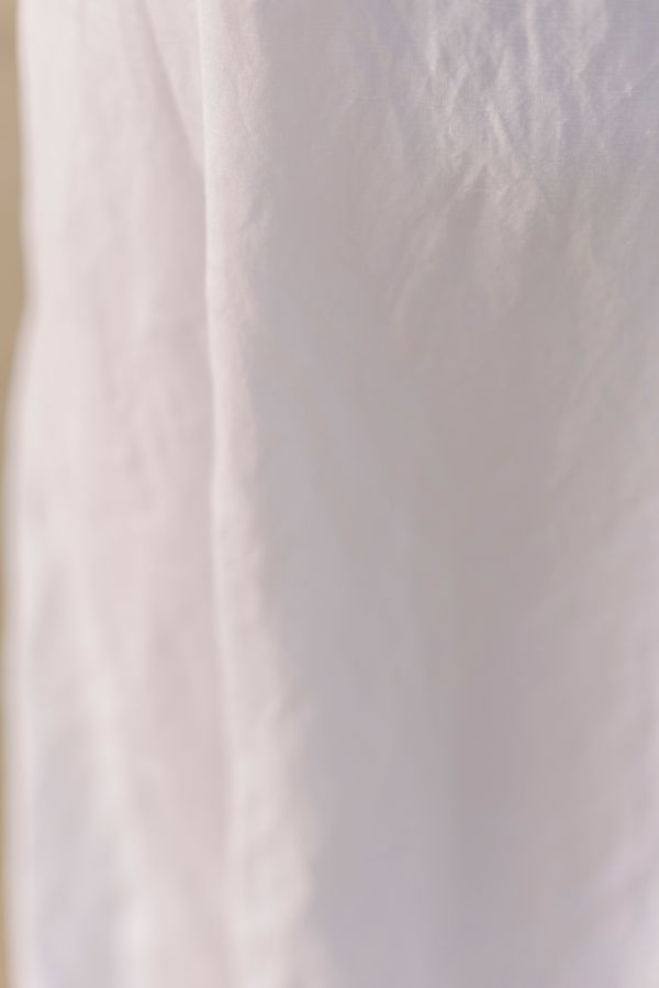 Soft cream woven fabric with luxury drape