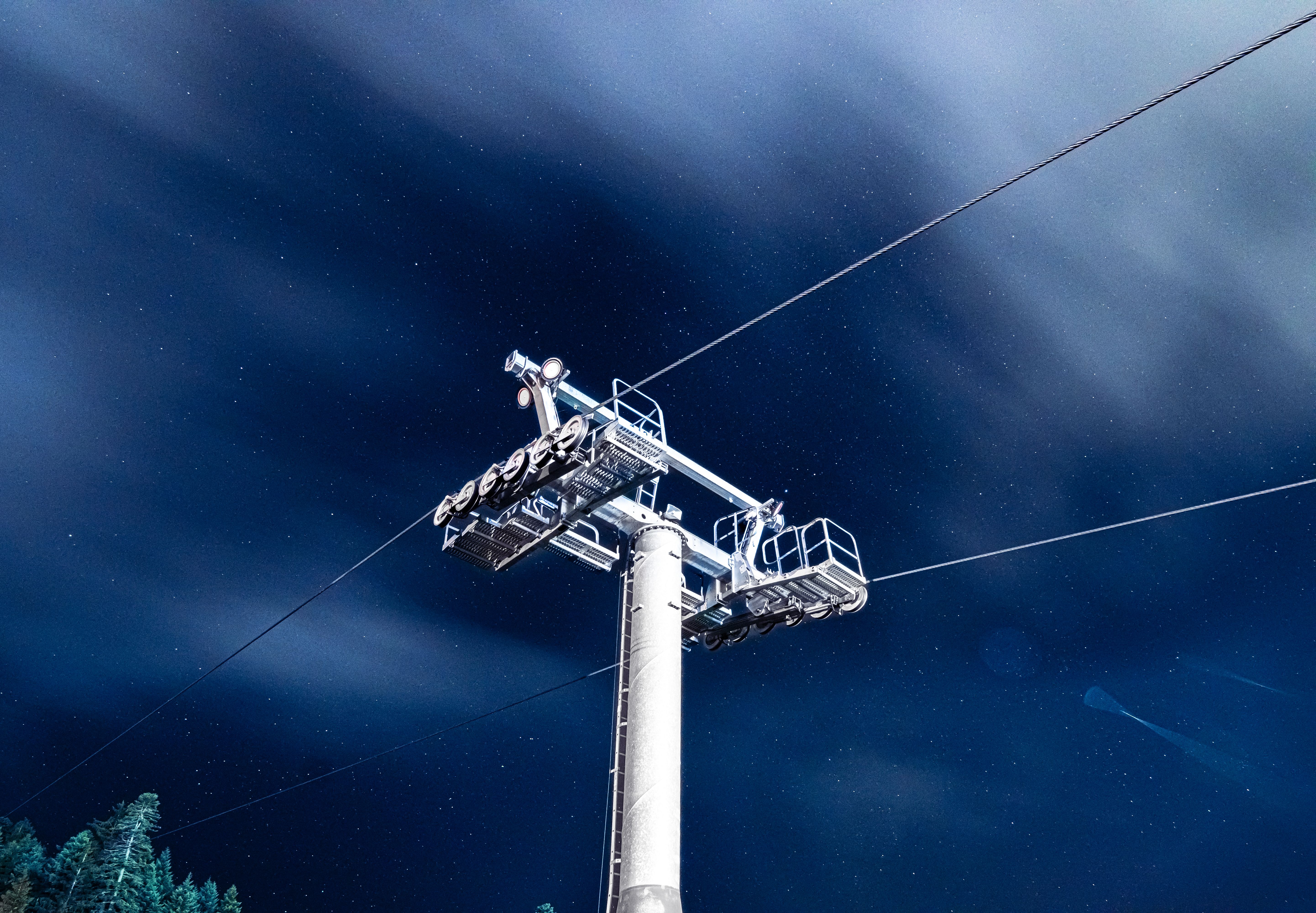 Stunning view of a cable car and starry night sky in Borovets, Bulgaria.