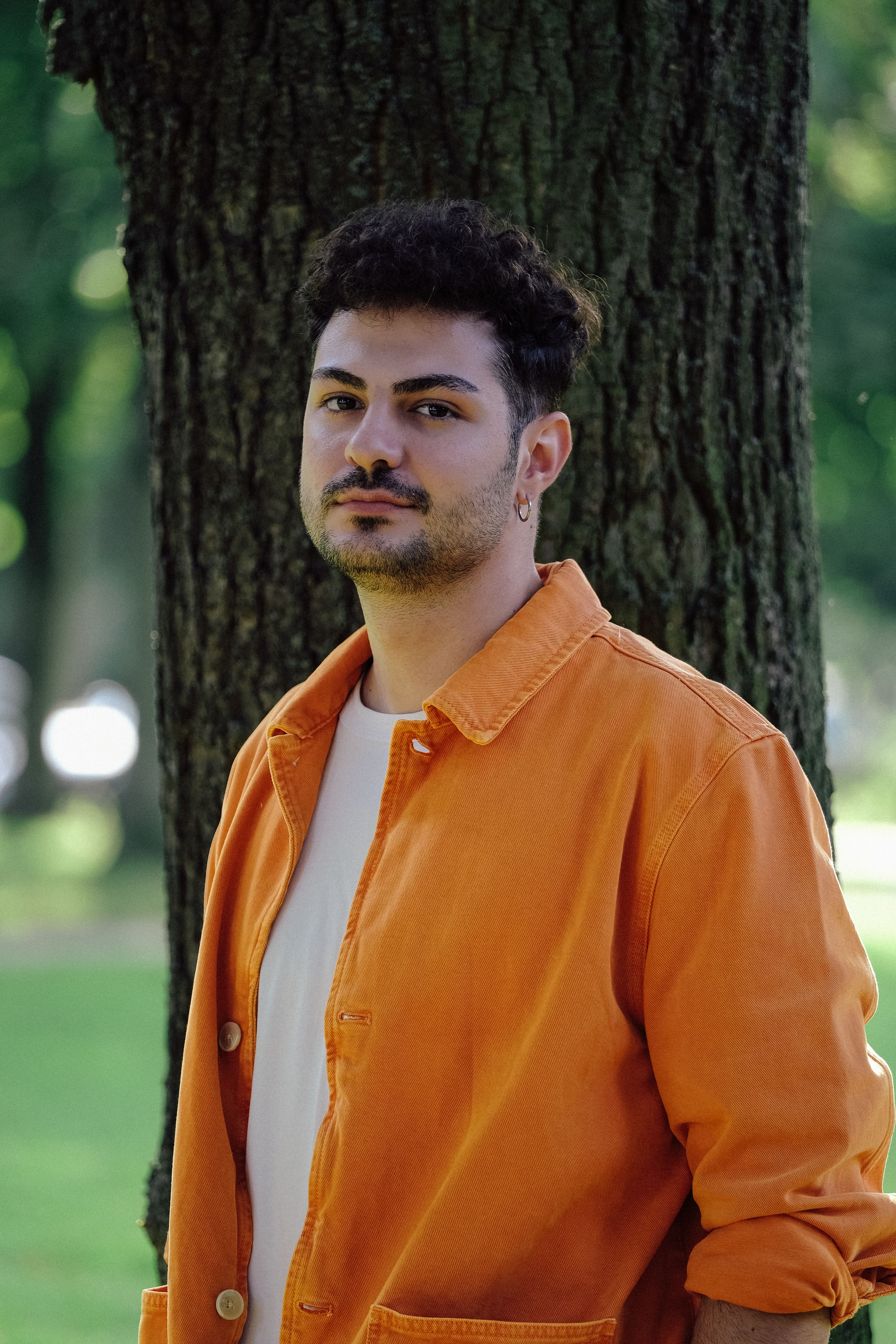 Portrait of Man in Orange Shirt · Free Stock Photo