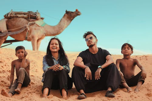 People Sitting On Sand