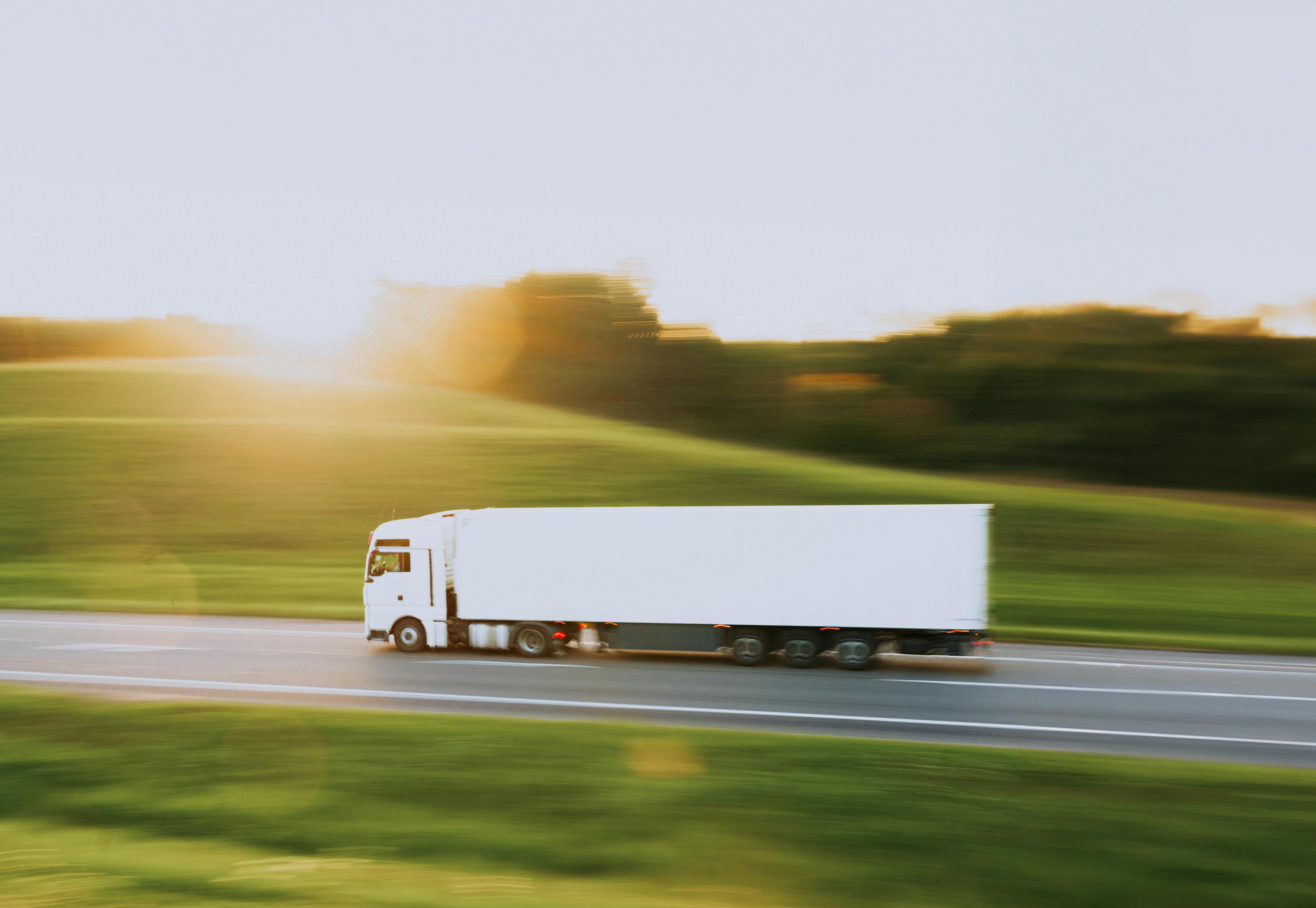 white truck in motion blur at sunset // белая фура в движении на закате ·  Free Stock Photo