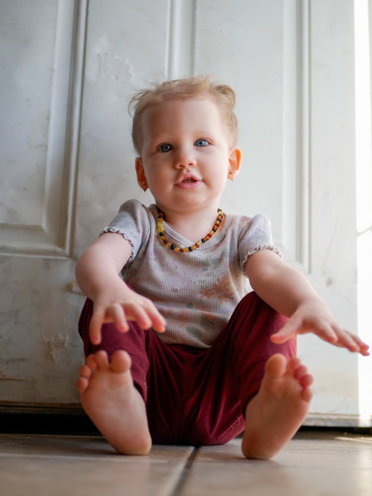 Baby Sitting On The Floor