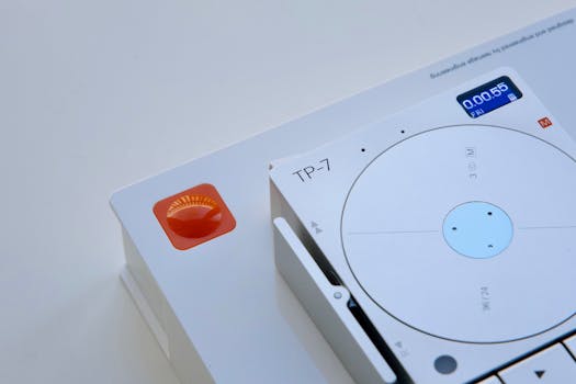 Modern TP-7 tape recorder on white background showcasing digital display and controls.