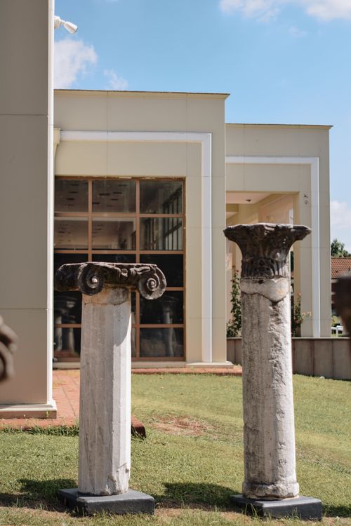 Free Historic Greek columns displayed outdoors at a museum in Turkey. Stock Photo