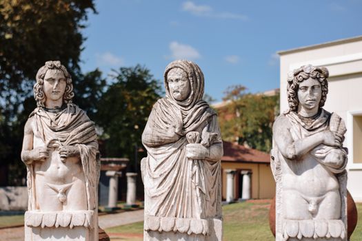 Outdoor display of marble sculptures at Kocaeli Museum, Turkey, under clear skies.
