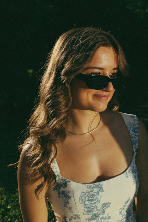 Woman Posing in Floral Pattern Strap Dress and Sunglasses 