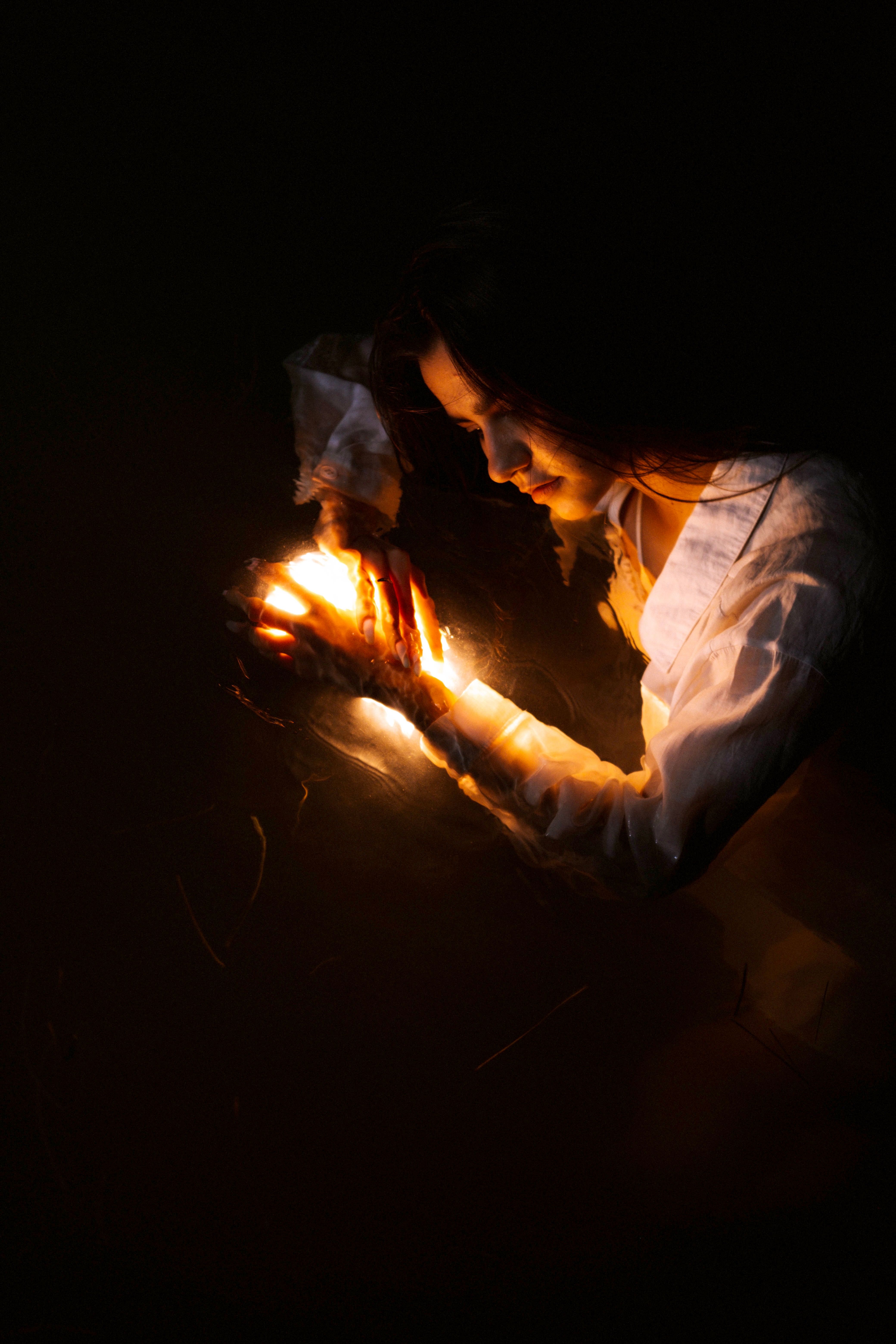 Silhouette of Woman Holding Lantern in Night · Free Stock Photo