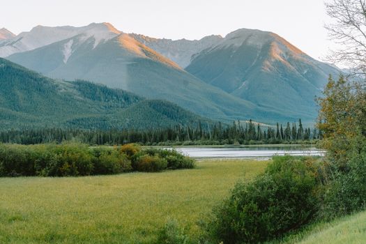 Serene summer landscape highlighting the majestic mountains of Banff National Park, Alberta, Canada.