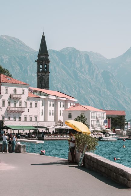 Charming view of Perast, Montenegro showcasing the iconic Saint Nikolas Church and Adriatic waterfront.