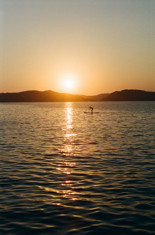 Man Paddling in Sea