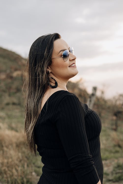 Woman in Sunglasses and Black Clothes