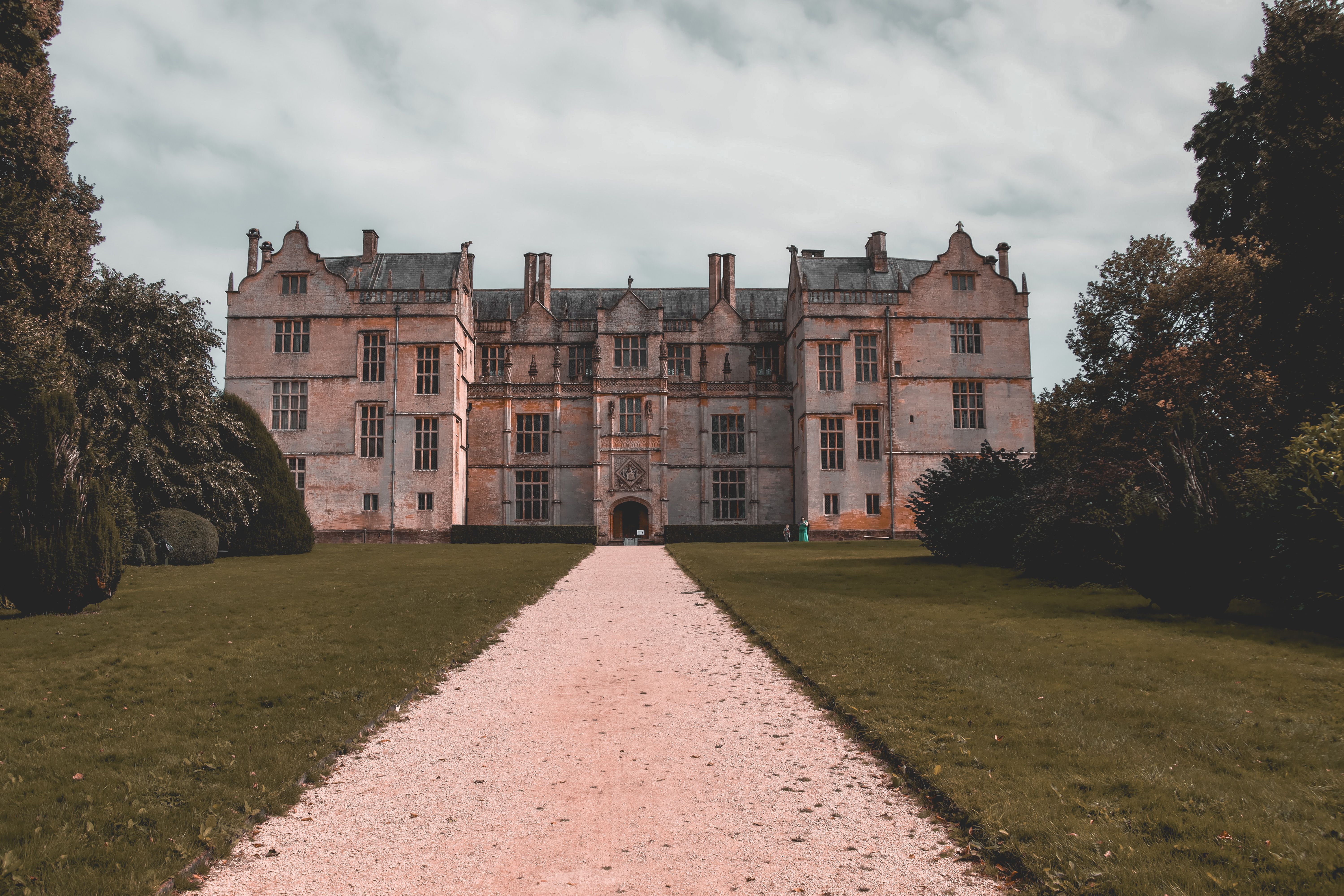Elizabethan brick facade of Mapledurham House beside the Thames
