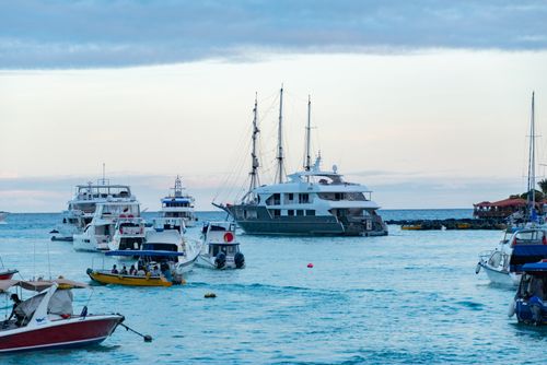 Free A tranquil harbor scene with yachts and boats at dusk, perfect for travel-themed visuals. Stock Photo
