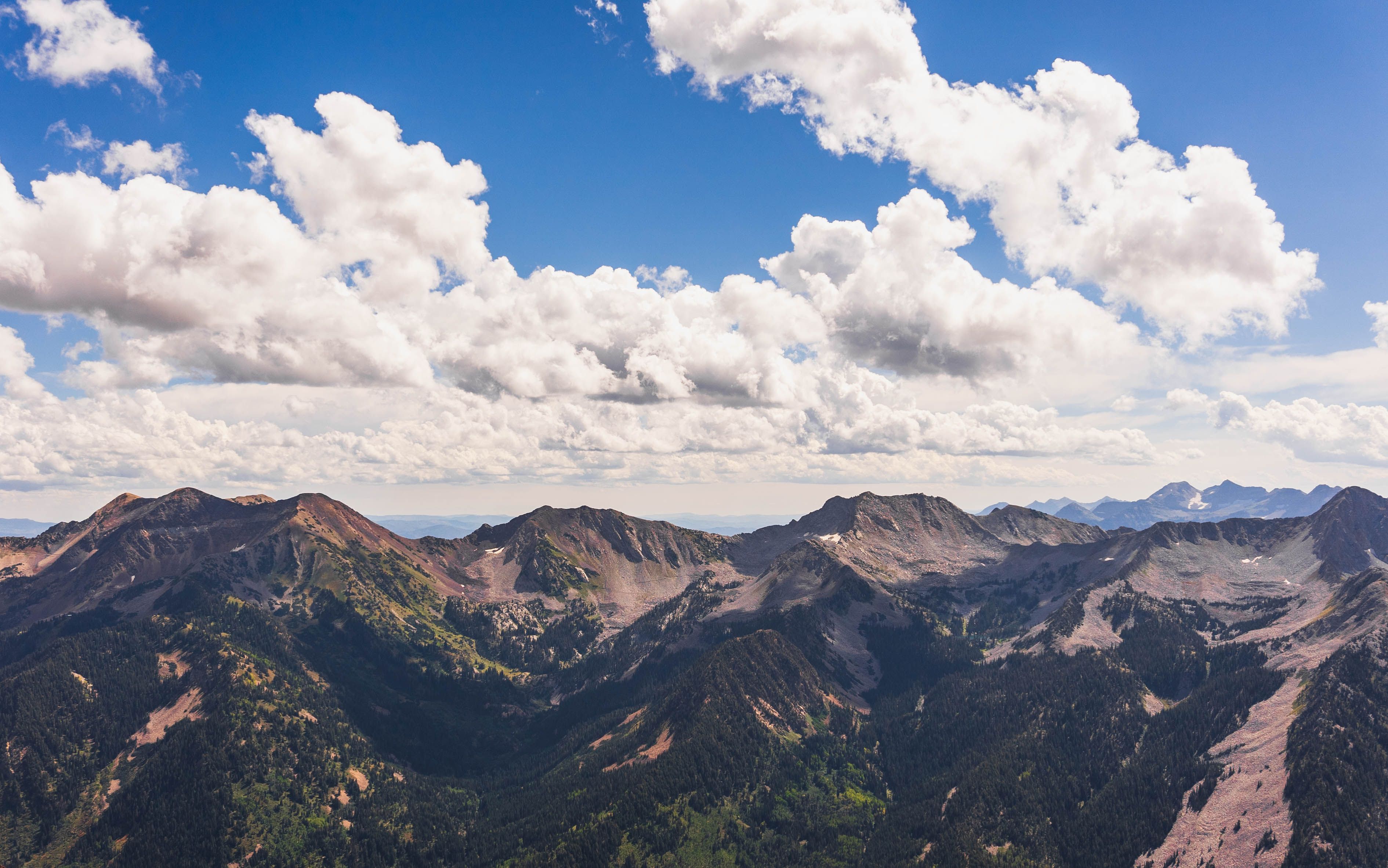 Fluffy White Clouds over Mountains in Snow · Free Stock Photo